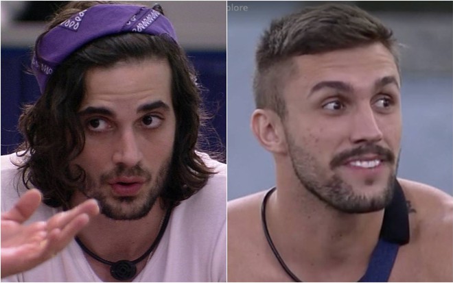Fiuk olha para o lado, usa camiseta branca e lenço roxo na cabeça; Arthur olha para o lado e está sem camiseta