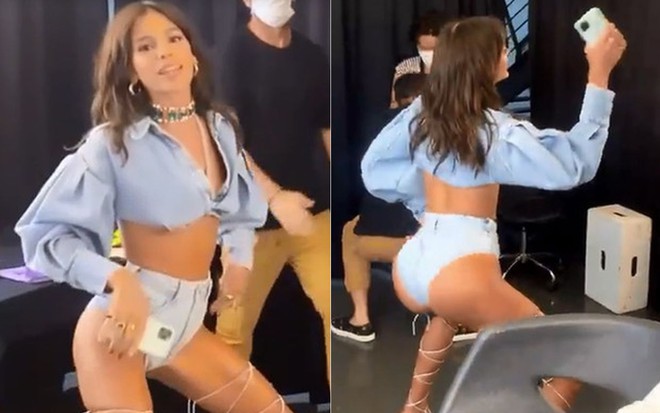 Bruna Marquezine de camisa jeans e shortinho rebolando