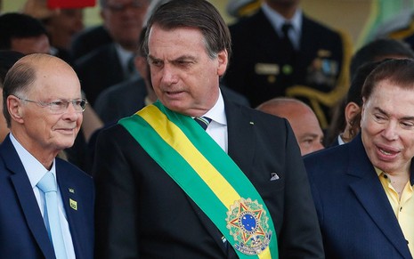 Edir Macedo, dono da Record, o presidente Jair Bolsonaro e apresentador Silvio Santos no desfile da Independência, em Brasília, em 7/9/2019