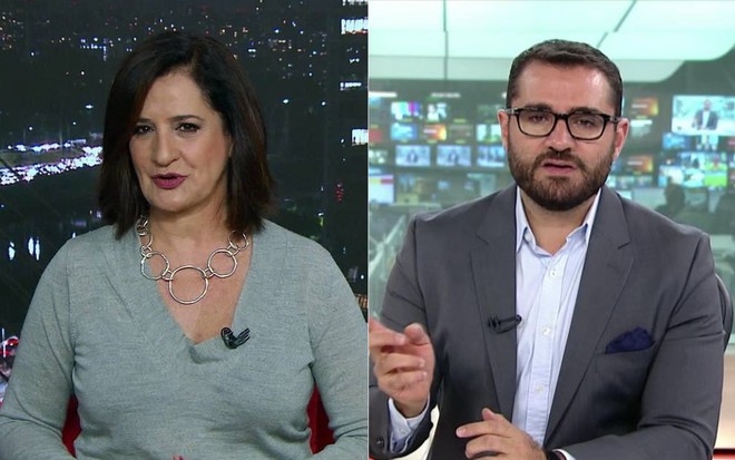 Mônica Waldvogel de blusa cinza e Marcelo Cosme de terno e camisa branca