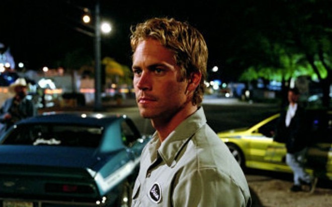 Paul Walker em cena do filme + Velozes + Furiosos