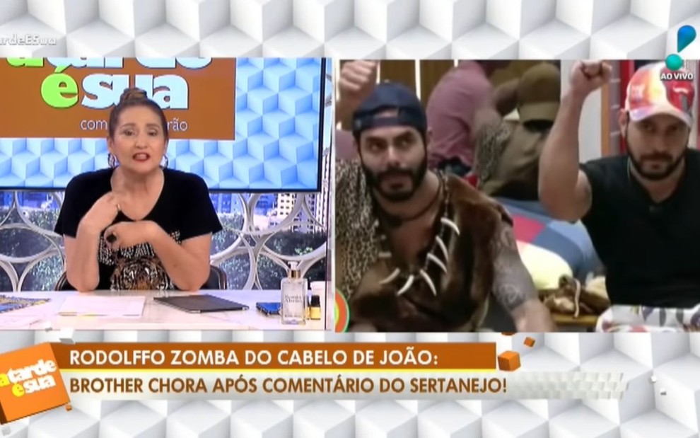 Sonia Abrão em tela dividida com foto de Rodolffo Matthaus e Caio Afiune vestidos como homens das cavernas no BBB21