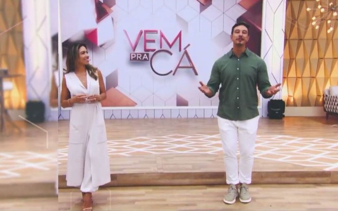 Patricia Abravanel e Gabriel Cartolano  no cenário do Vem Pra Cá; telão ao fundo
