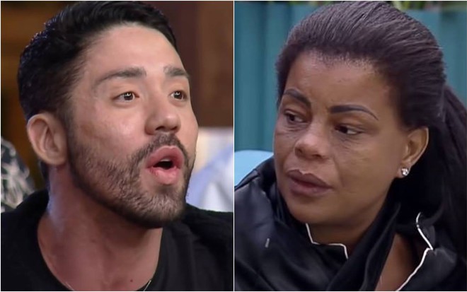 Rico olha para o lado, está com a boca aberta e veste camiseta preta; Tati olha para o lado e veste pijama preto