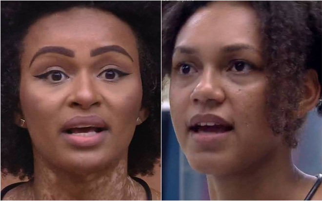 Natália olha para frente, está com o cabelo solto e a boca aberta; Jessilane olha para o lado, está com o cabelo preso e a boca aberta