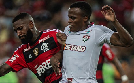 Imagem com jogadores Gerson (Flamengo), à esquerda, e Arias (Fluminense), à direita