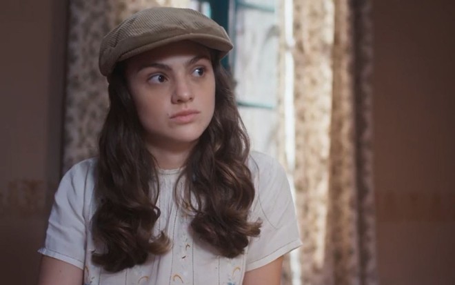 Olívia (Debora Ozório) em cena de Além da Ilusão