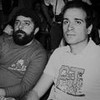 Foto antiga de Luiz Inácio Lula da Silva e Celso Daniel em imagem de arquivo em preto e branco; eles olham sérios para o lado