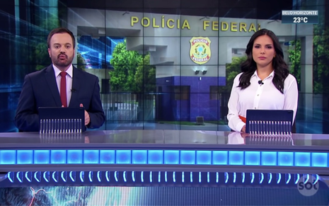 Os apresentadores Marcelo Torres e Márcia Dantas na apresentação do telejornal SBT Brasil, do SBT