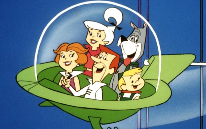 Cena do desenho animado os Jetsons, em que família de pai, mãe, filha adolescente, filho criança e cachorro estão numa nave espacial