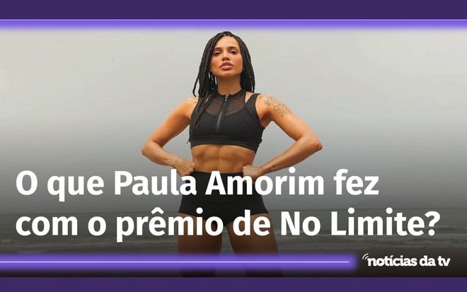 De top e short preto, Paula Amorim posa com as duas mãos na cintura