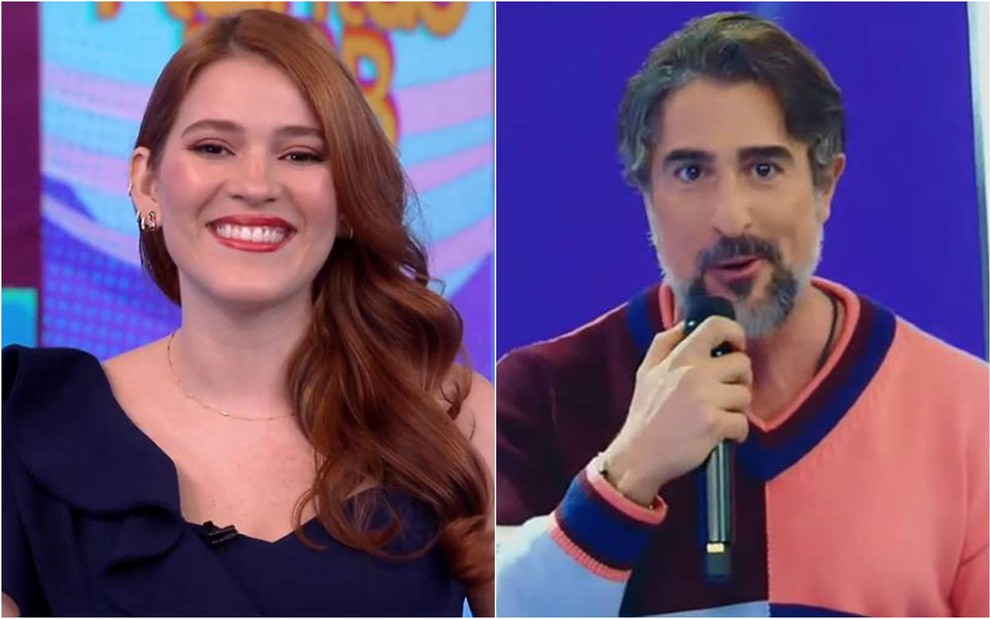 Ana Clara sorri, está na frente de um fundo azul e veste camiseta preta; Marcos Mion segura microfone, veste blusa colorida e está na frente de um fundo azul