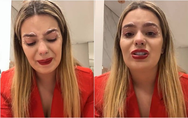 Viih Tube chora, está com o cabelo solto e veste terno vermelho
