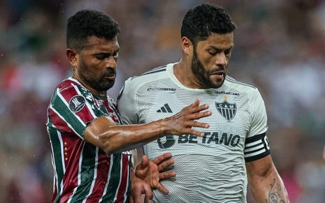 Imagem com os jogadores Thiago Santos (Fluminense), à esquerda, e Hulk (Atlético-MG), à direita