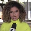 Victória Henrique durante entrada em telejornal da Globo