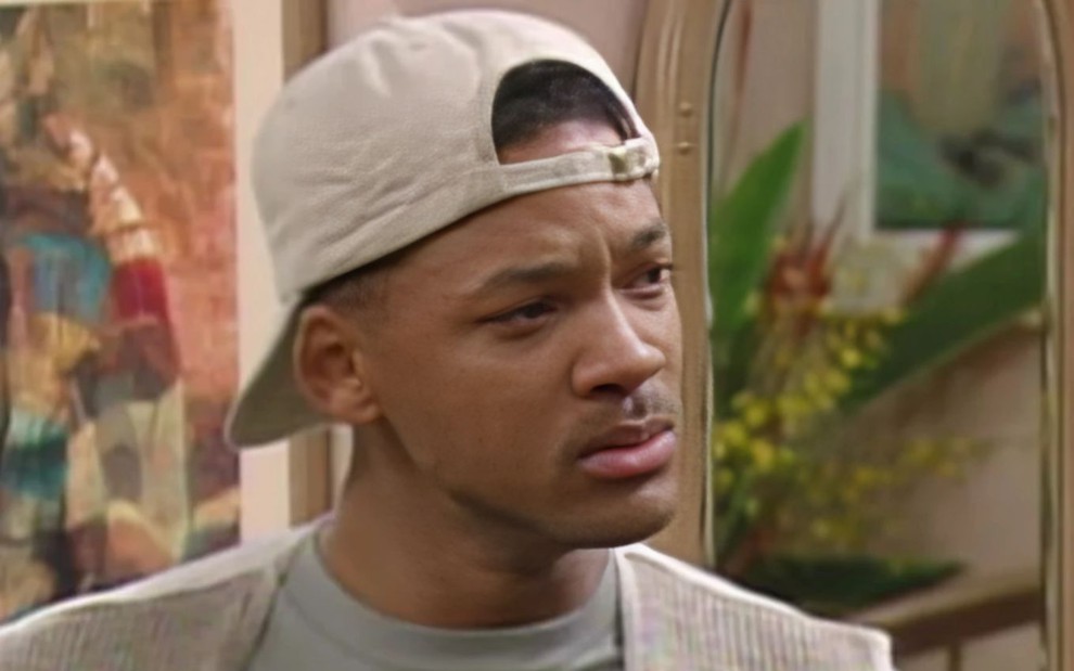 Will Smith com expressão séria em cena de Um Maluco no Pedaço (1990-1996)