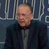 Galvão Bueno sorri ao centro de bancada esportiva com Casagrande, Mauro Naves e Falcão no estúdio da Band
