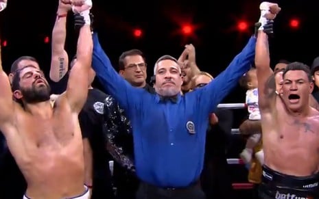Duda Nagle e Popó dentro de um ringue, separados por um juiz