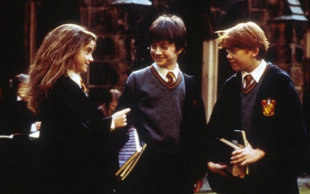 Emma Watson, Daniel Radcliffe e Rupert Grint em cena de Harry Potter e a Pedra Filosofal
