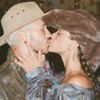 João Guilherme beija Bruna Marquezine em foto do Instagram; os dois vestem trajes country, em uma festa junina