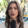 Isadora Marcos em link ao vivo do Bom Dia São Paulo; repórter está em cenário com árvores e carros de polícia