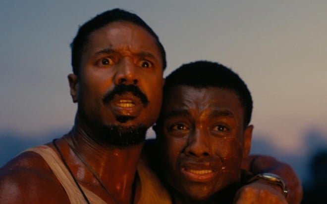 Michael B. Jordan e Miles Caton em cena de Pecadores