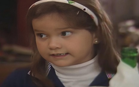 A atriz Viviane Pinheiro com expressão séria em cena de A Viagem