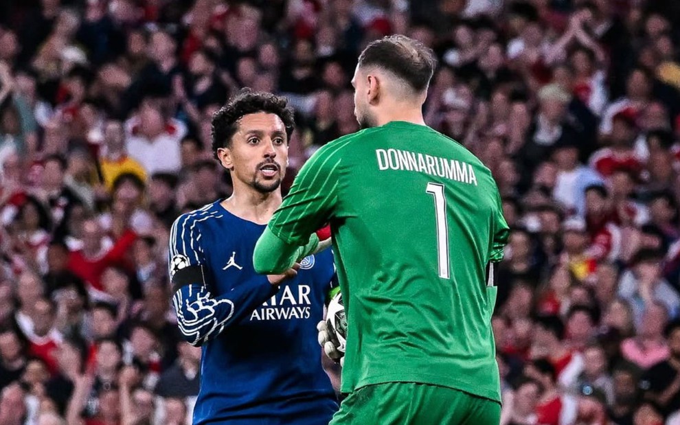 O brasileiro Marquinhos e o italiano Donnarumma em jogo do PSG na Champions League ao vivo