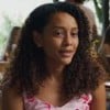 Taís Araujo sorri discretamente em cena como Raquel na novela Vale Tudo