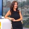 Sabina Simonato usa um vestido preto e está apoiada na bancada do Bom Dia São Paulo