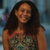 Taís Araujo sorri em cena como Raquel na novela Vale Tudo