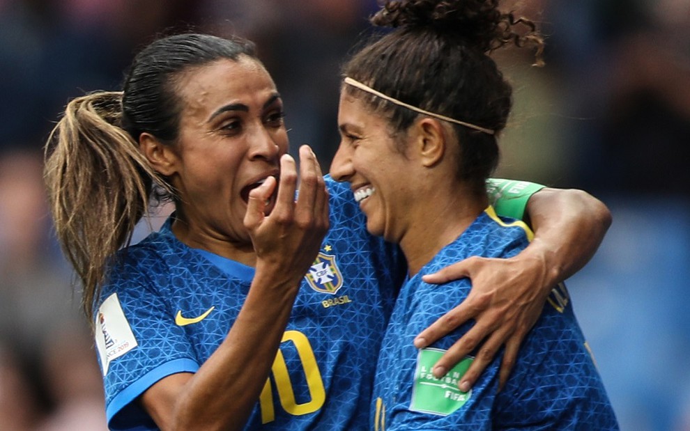 Marta e Cristiane comemoram gol da seleção contra a Austrália: jogo deixou a Globo na liderança - DIVULGAÇÃO/CBF
