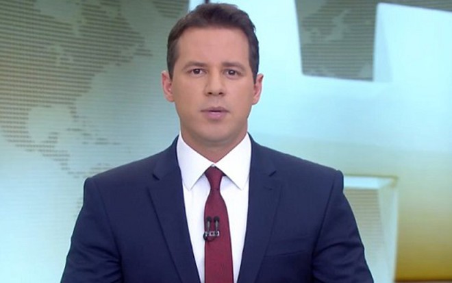 O âncora Dony De Nuccio na edição de ontem (13) do Jornal Hoje, que perdeu para a Record - Reprodução/Globo