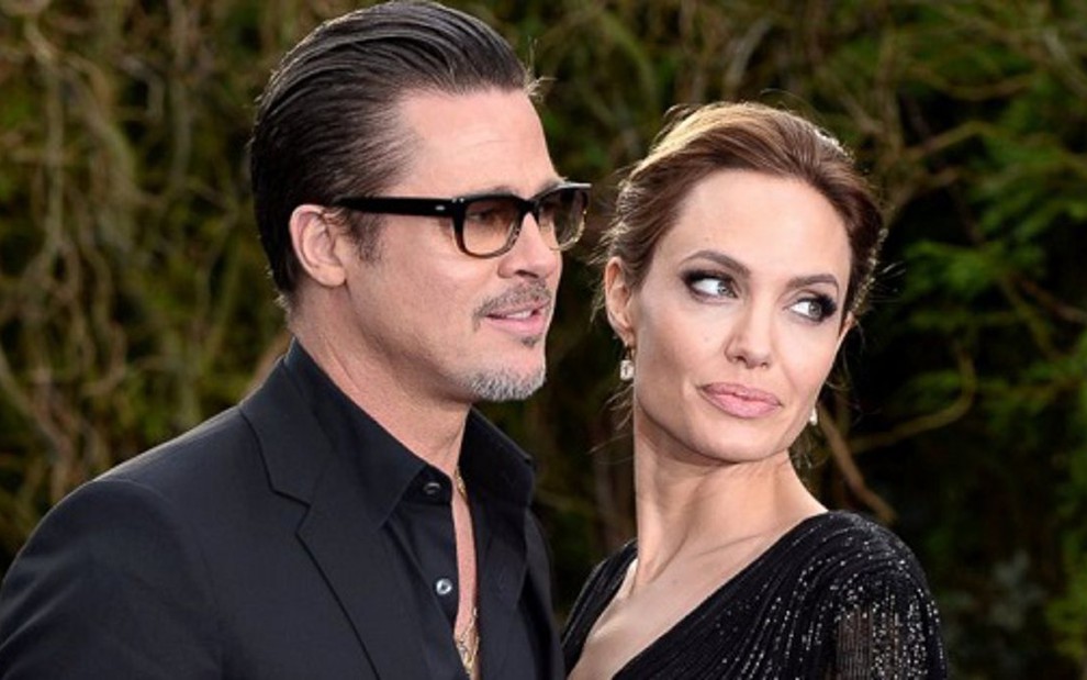 Os atores Brad Pitt e Angelina Jolie posam para fotos em evento do filme Malévola (2014), da Disney - Divulgação