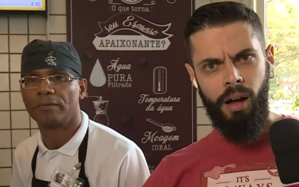 Repórter Cauê Fabiano com expressão indignada em reportagem ao vivo de uma padaria no Mais Você 
